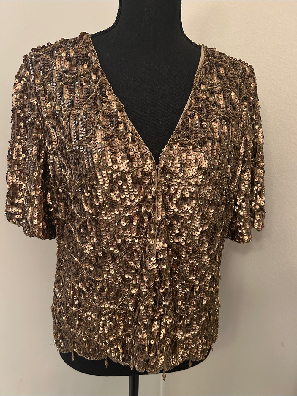 Chicoโs open front all over sequins cardigan.